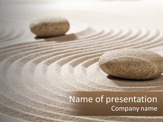 Two Rocks Sitting On Top Of A Sandy Area PowerPoint Template