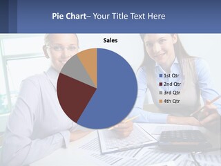 Two Women Sitting At A Desk With A Calculator And Pen PowerPoint Template