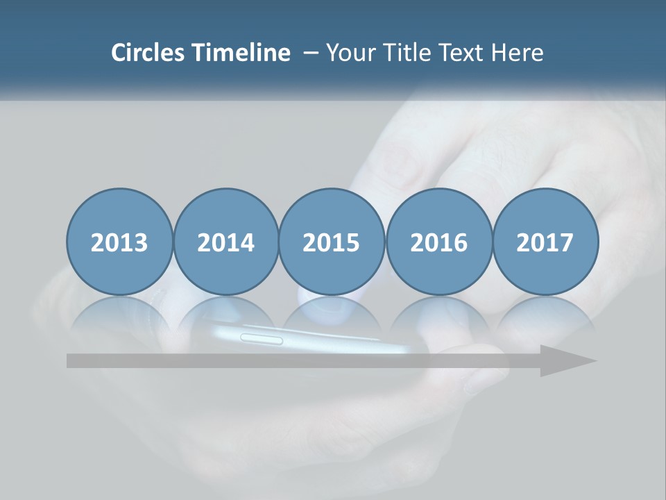 A Man Holding A Cell Phone In His Hand PowerPoint Template
