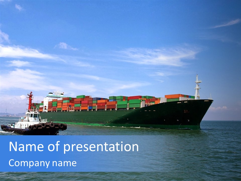 A Large Cargo Ship In The Ocean With A Tug Boat In Front Of It PowerPoint Template