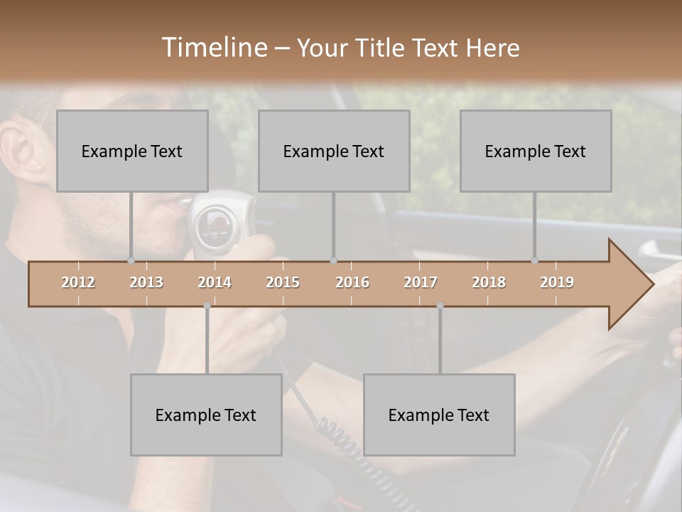A Man Sitting In A Car Holding A Camera PowerPoint Template