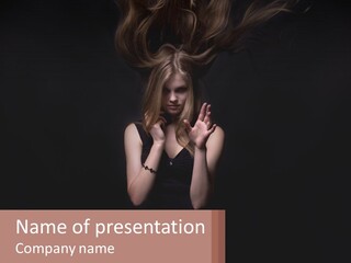 A Woman With Her Hair Blowing In The Wind PowerPoint Template