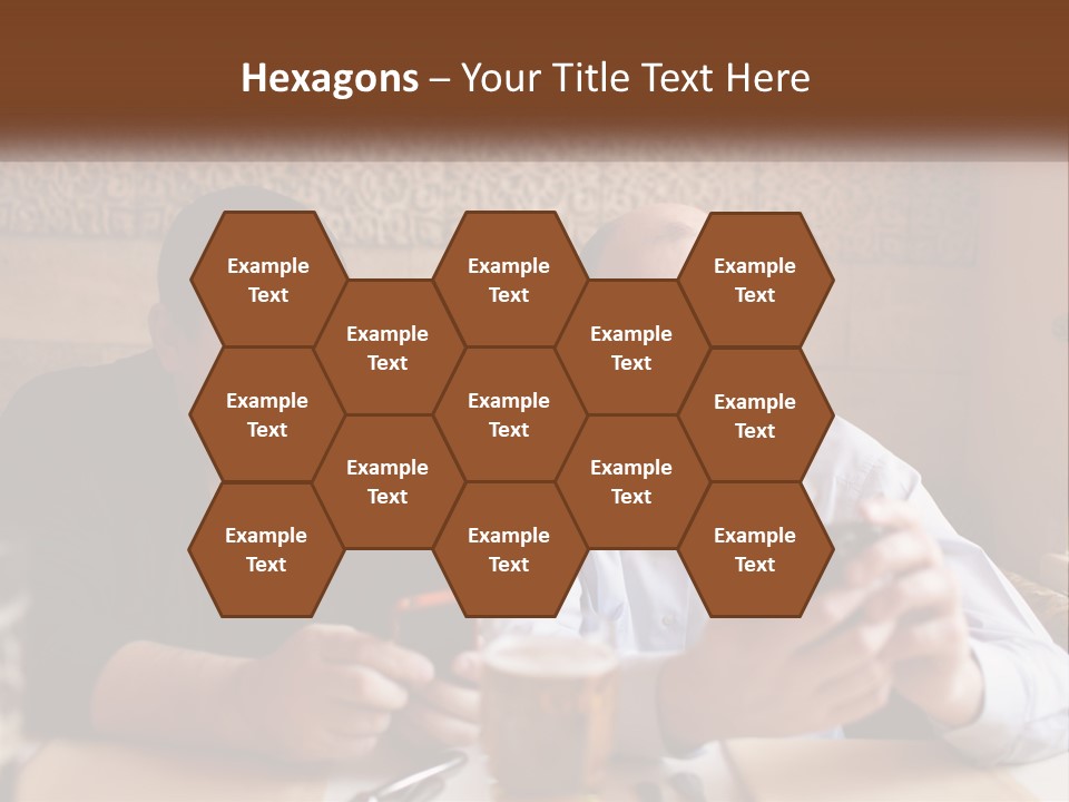 Two Men Sitting At A Table Looking At A Cell Phone PowerPoint Template