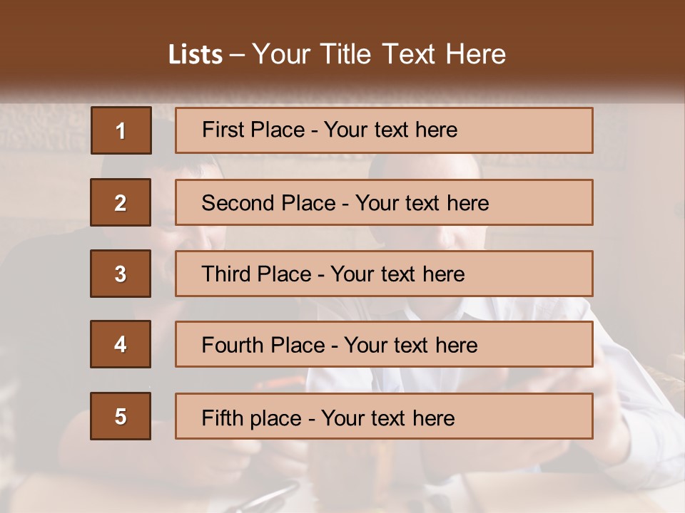 Two Men Sitting At A Table Looking At A Cell Phone PowerPoint Template