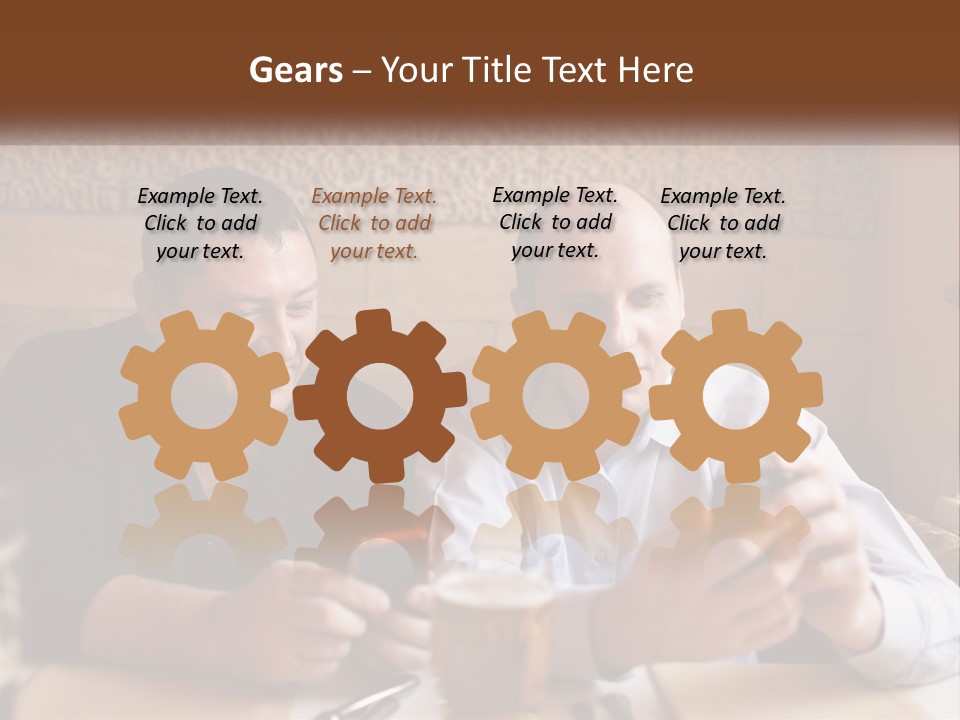 Two Men Sitting At A Table Looking At A Cell Phone PowerPoint Template