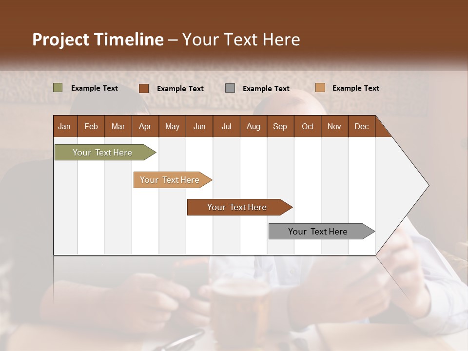 Two Men Sitting At A Table Looking At A Cell Phone PowerPoint Template