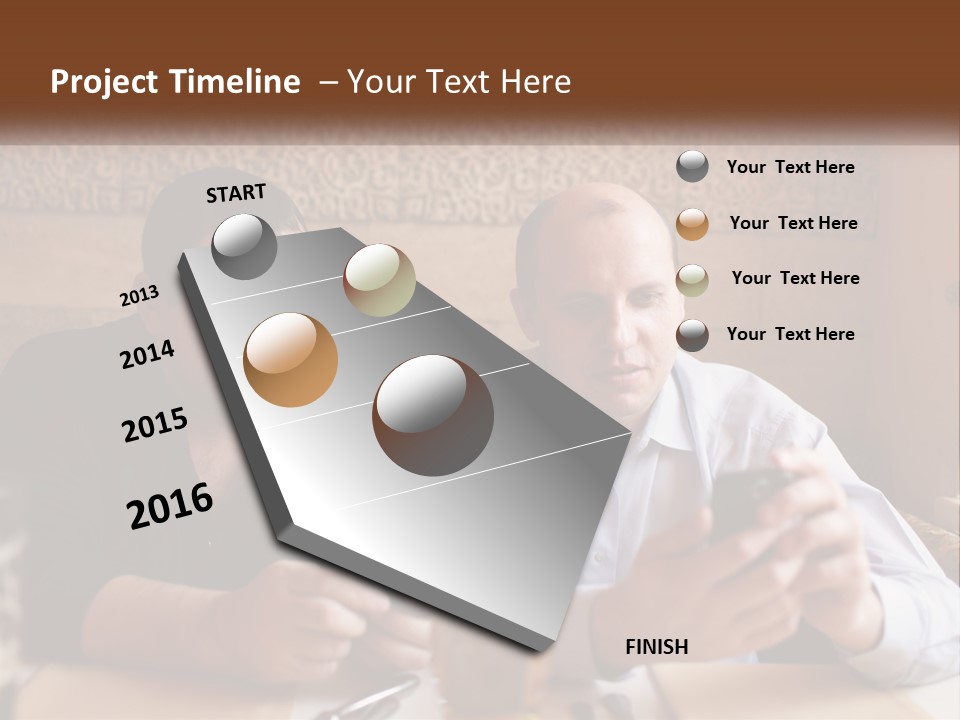 Two Men Sitting At A Table Looking At A Cell Phone PowerPoint Template