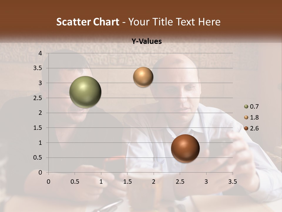 Two Men Sitting At A Table Looking At A Cell Phone PowerPoint Template