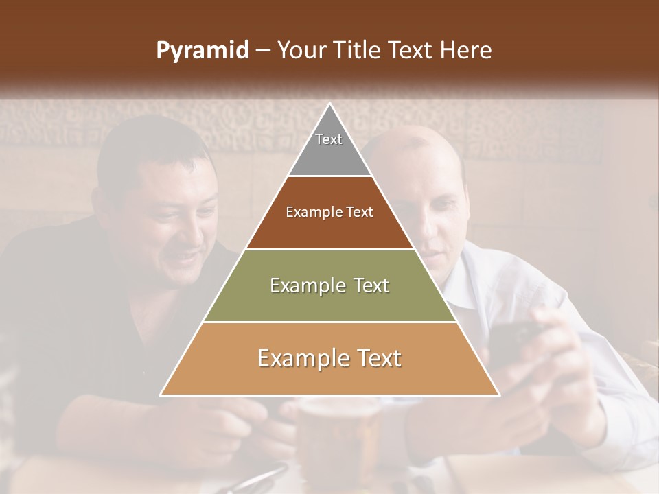 Two Men Sitting At A Table Looking At A Cell Phone PowerPoint Template