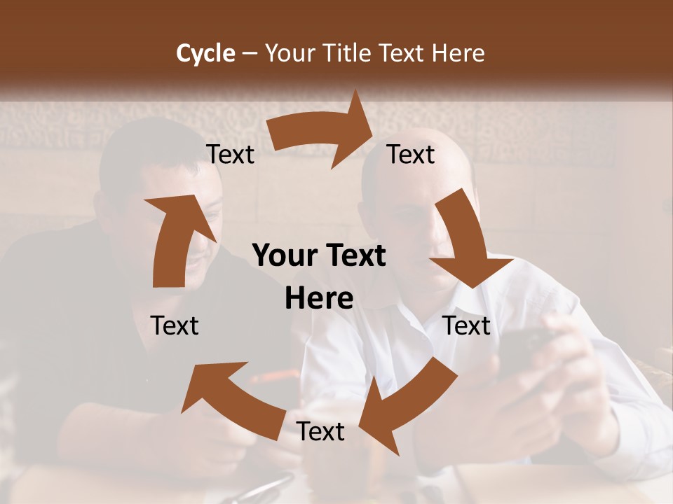 Two Men Sitting At A Table Looking At A Cell Phone PowerPoint Template