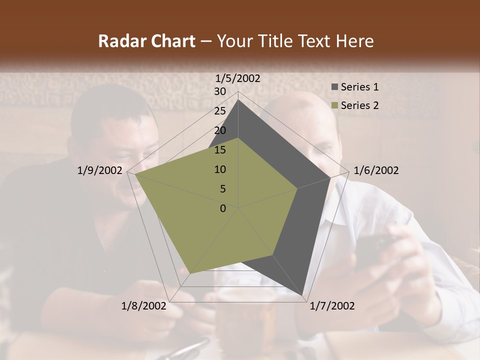 Two Men Sitting At A Table Looking At A Cell Phone PowerPoint Template