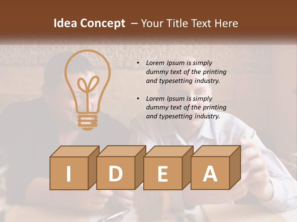 Two Men Sitting At A Table Looking At A Cell Phone PowerPoint Template