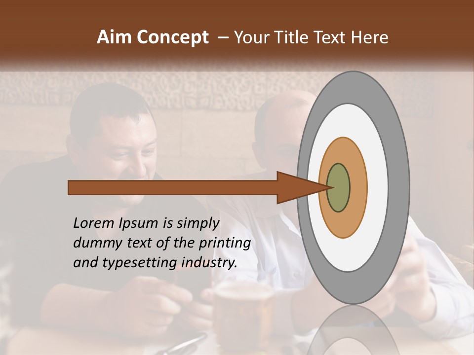 Two Men Sitting At A Table Looking At A Cell Phone PowerPoint Template