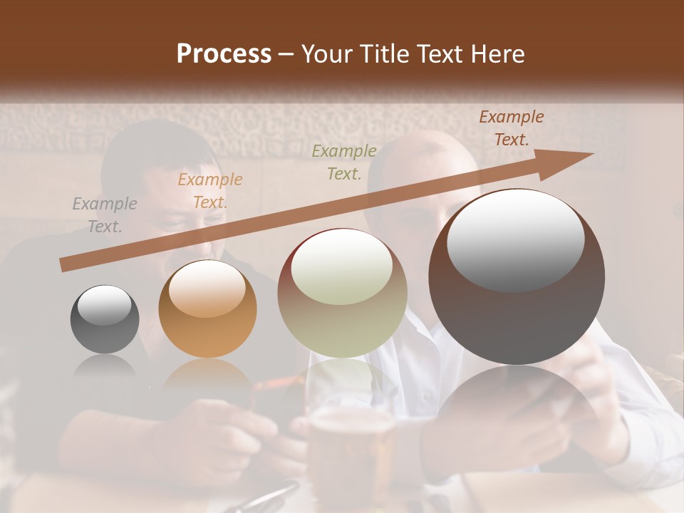 Two Men Sitting At A Table Looking At A Cell Phone PowerPoint Template