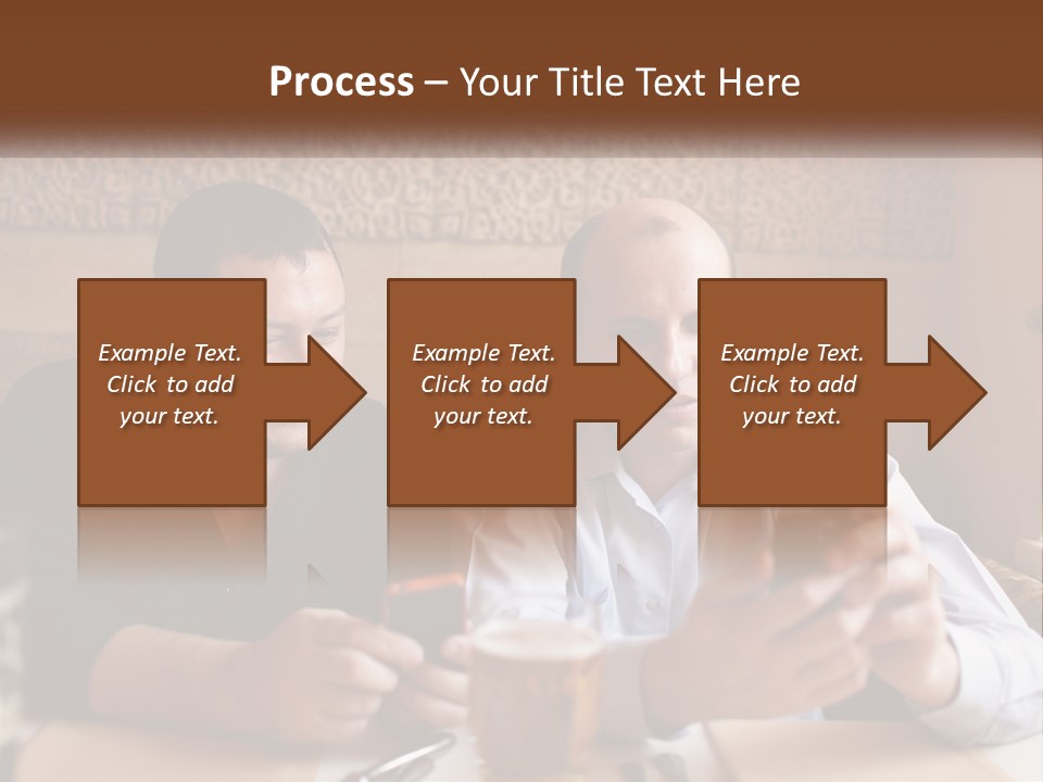 Two Men Sitting At A Table Looking At A Cell Phone PowerPoint Template