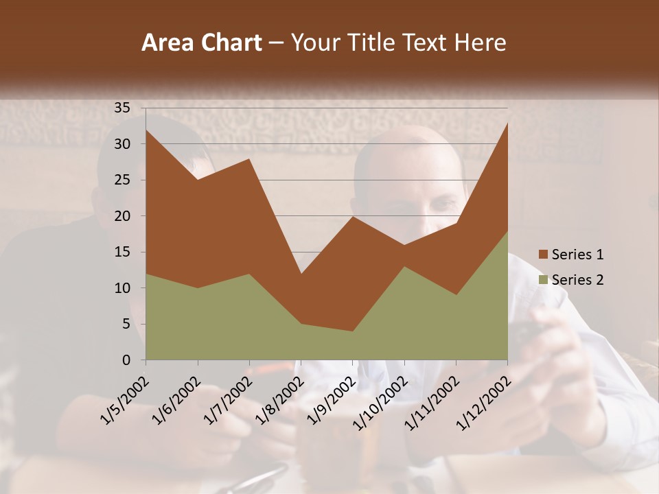 Two Men Sitting At A Table Looking At A Cell Phone PowerPoint Template