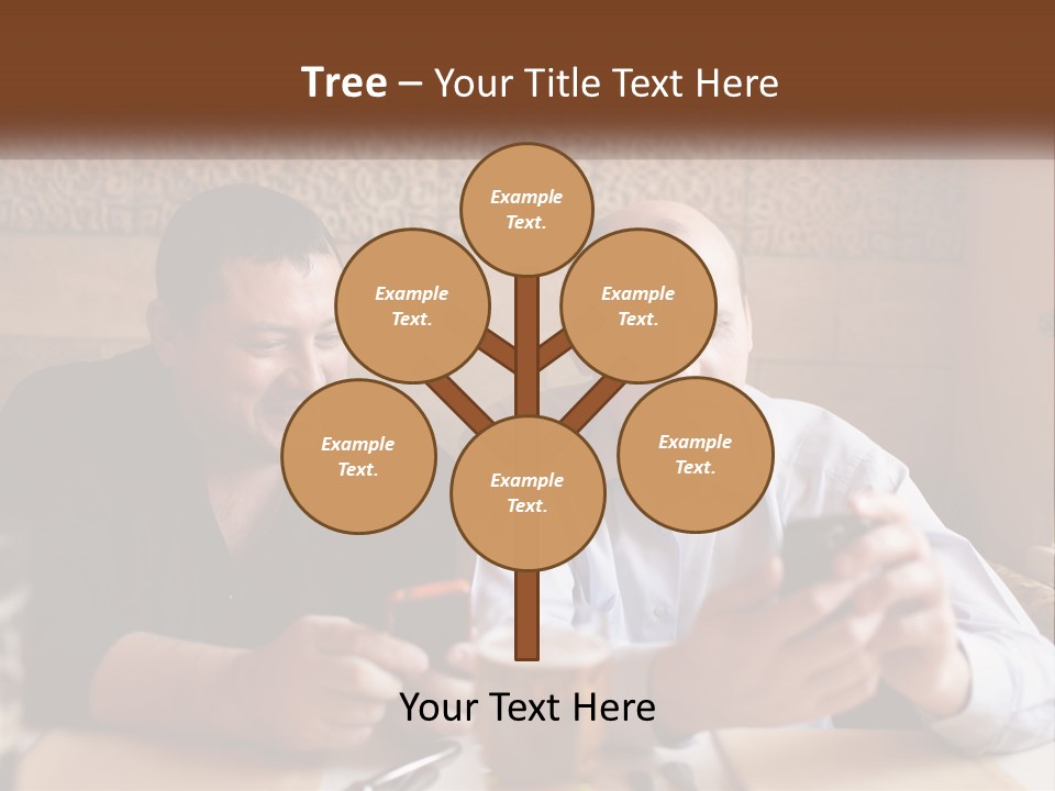 Two Men Sitting At A Table Looking At A Cell Phone PowerPoint Template