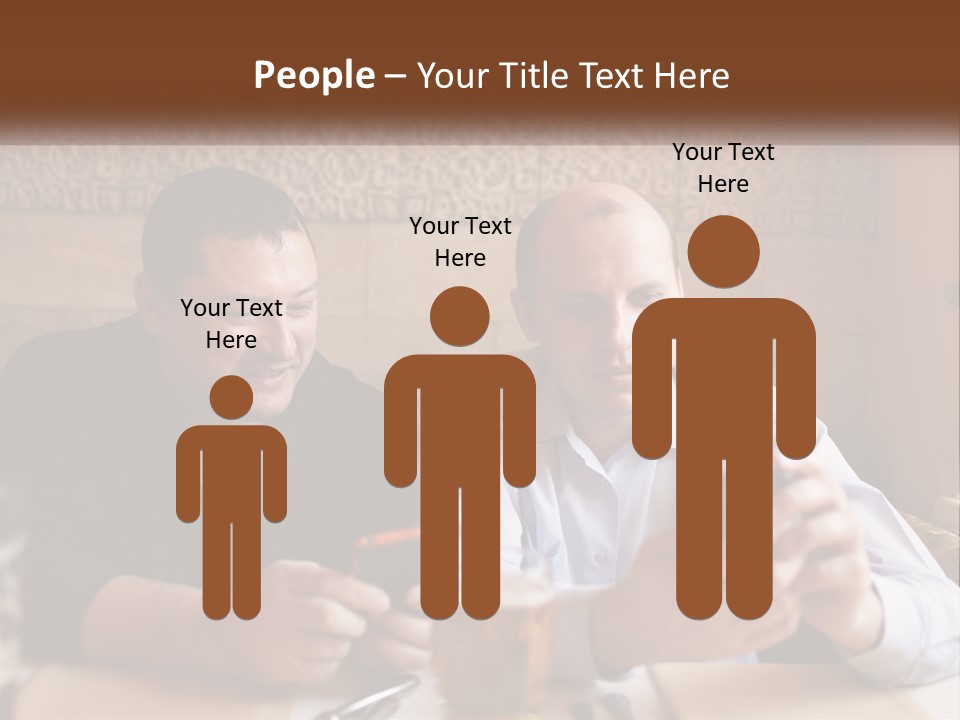 Two Men Sitting At A Table Looking At A Cell Phone PowerPoint Template
