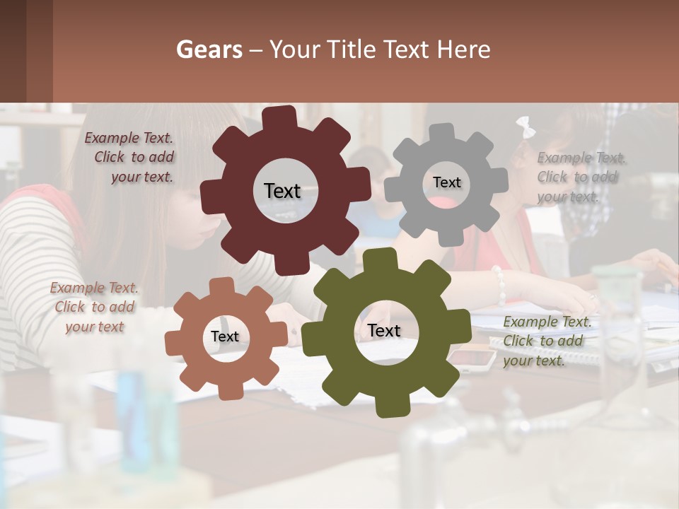 A Group Of People Sitting At A Table Writing PowerPoint Template