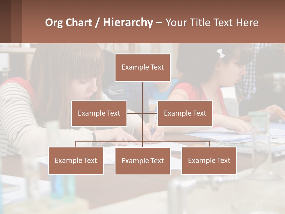 A Group Of People Sitting At A Table Writing PowerPoint Template