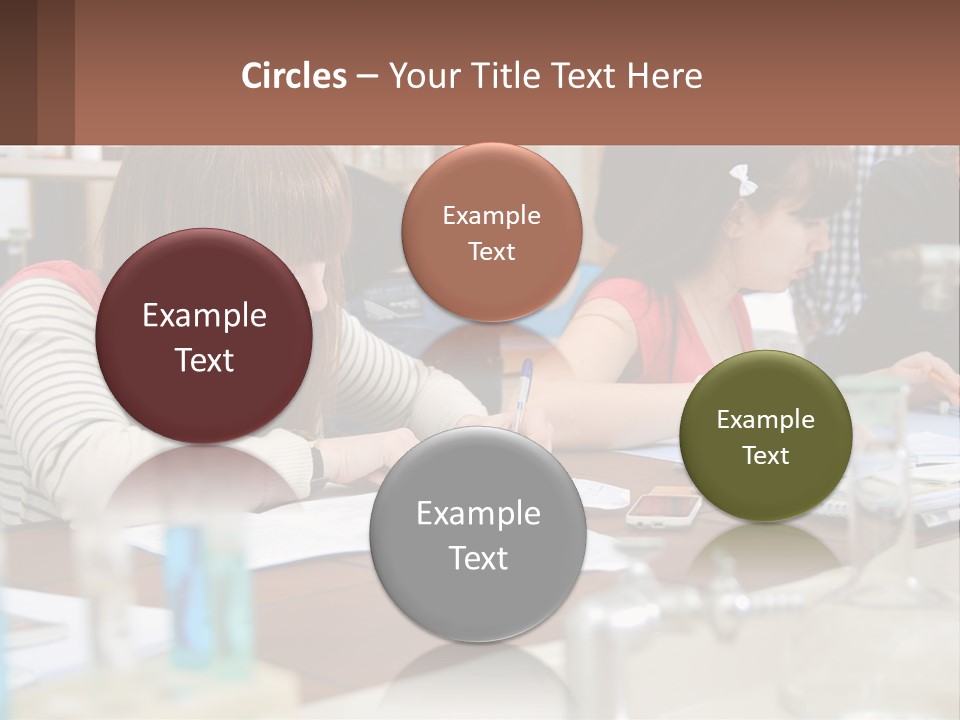 A Group Of People Sitting At A Table Writing PowerPoint Template