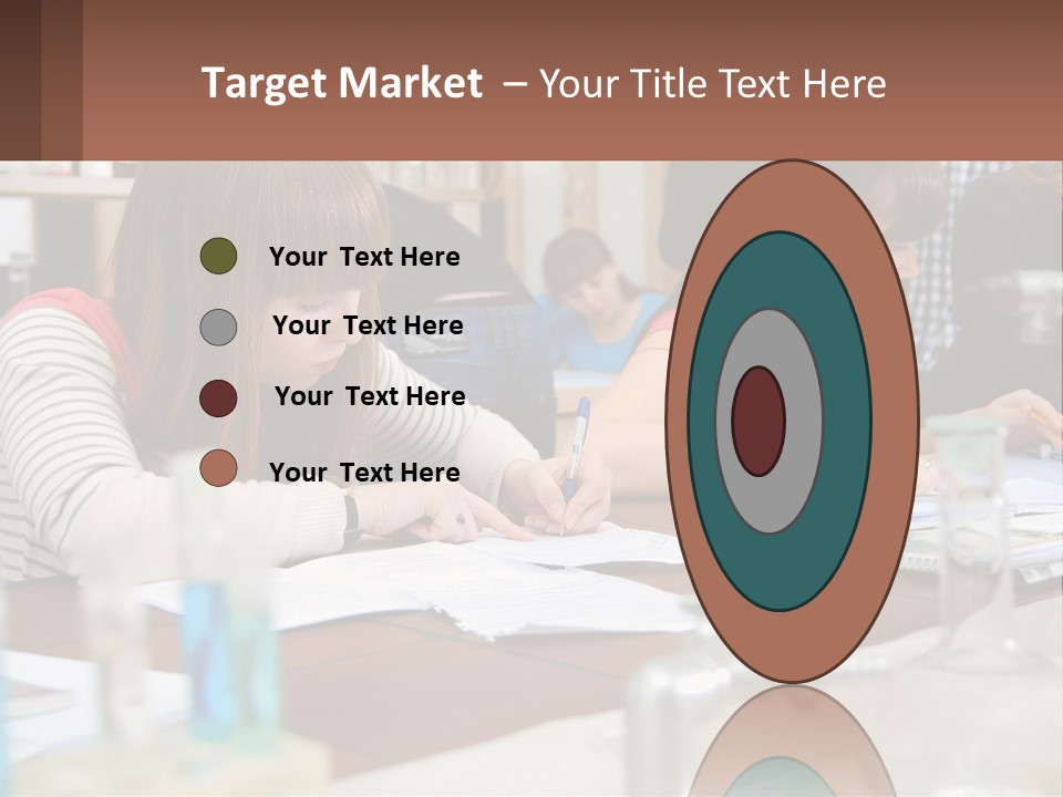 A Group Of People Sitting At A Table Writing PowerPoint Template