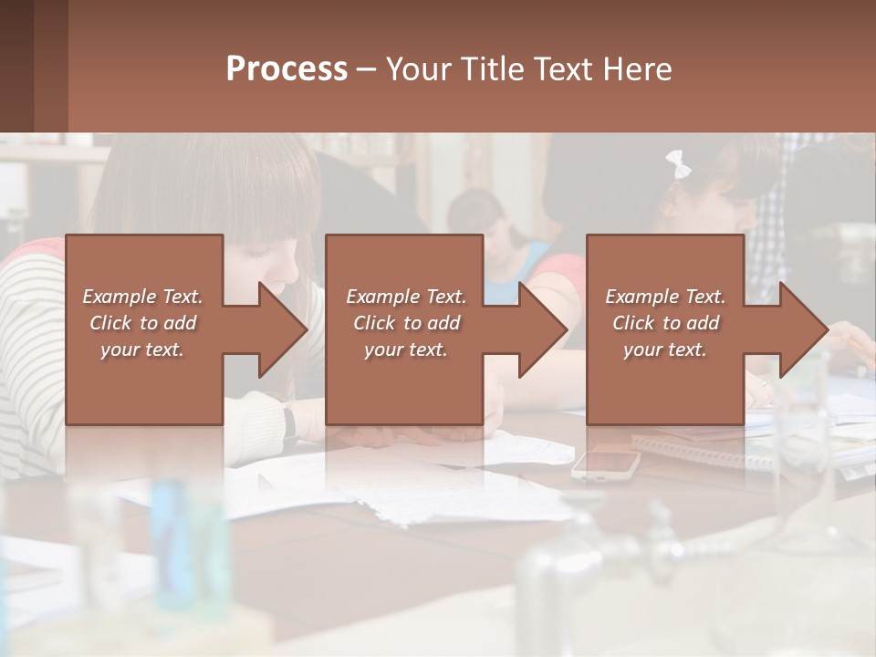 A Group Of People Sitting At A Table Writing PowerPoint Template