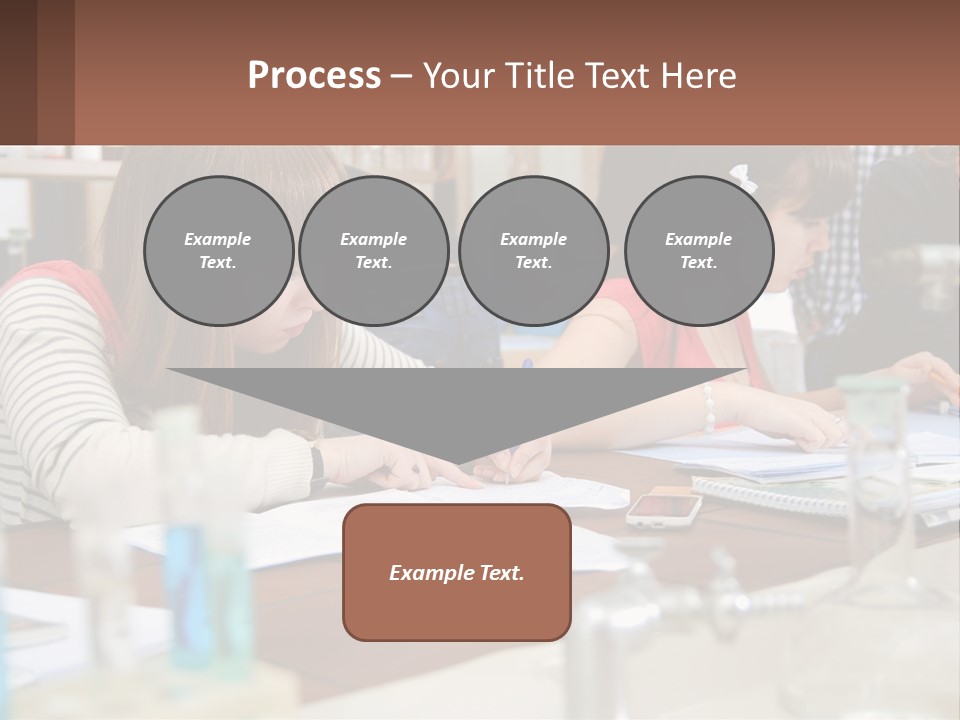 A Group Of People Sitting At A Table Writing PowerPoint Template