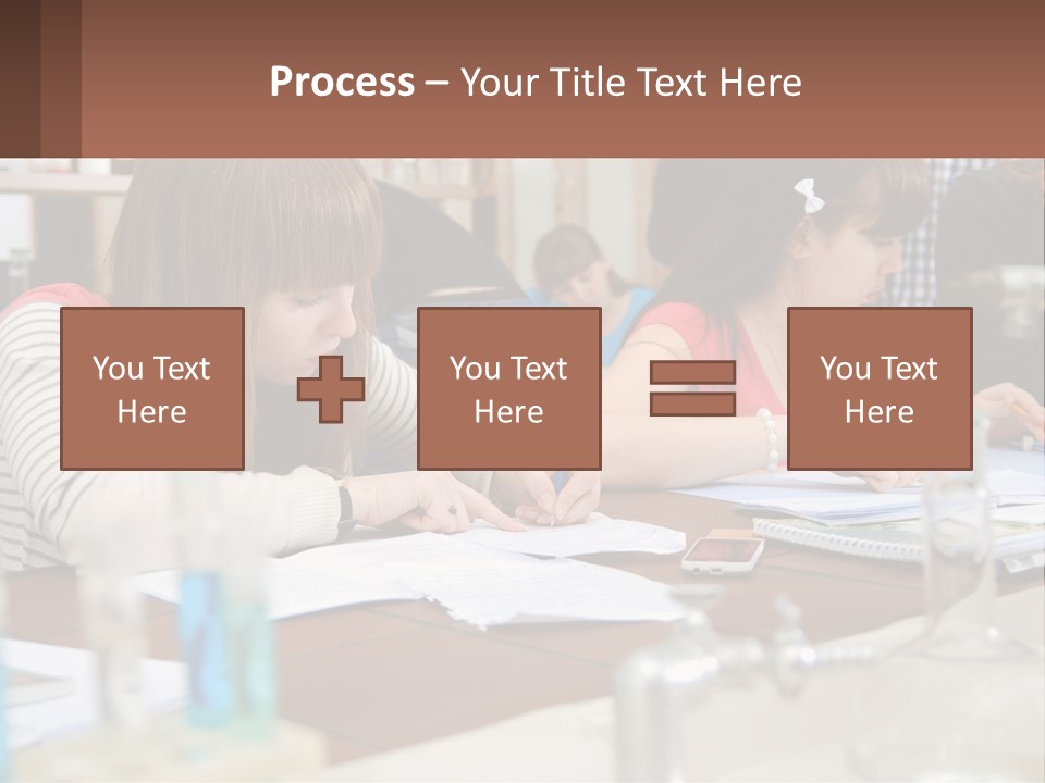 A Group Of People Sitting At A Table Writing PowerPoint Template