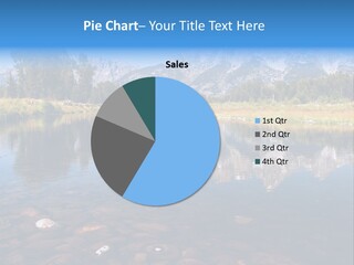 A Lake With Mountains In The Background PowerPoint Template