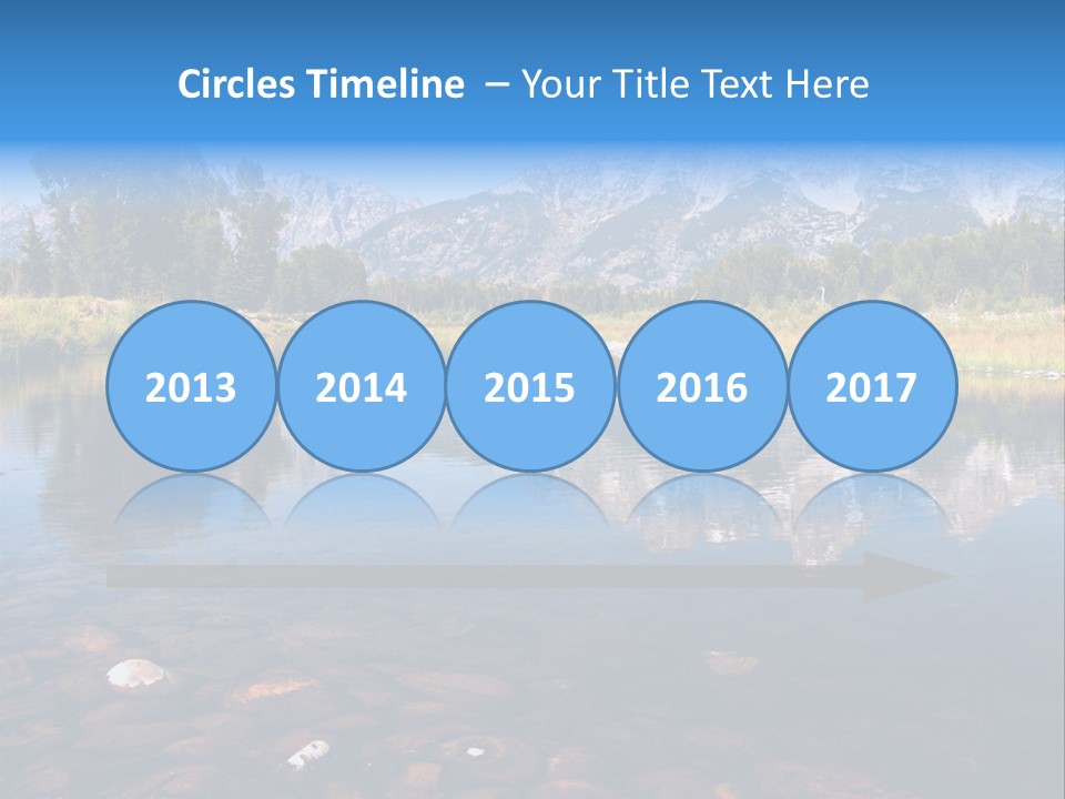 A Lake With Mountains In The Background PowerPoint Template