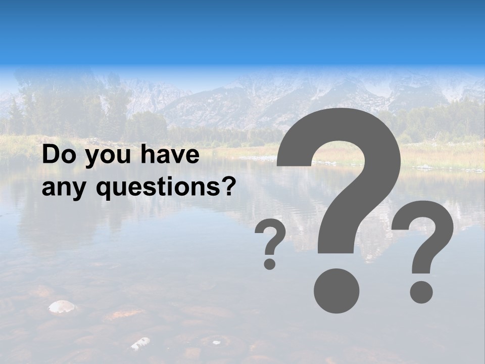 A Lake With Mountains In The Background PowerPoint Template