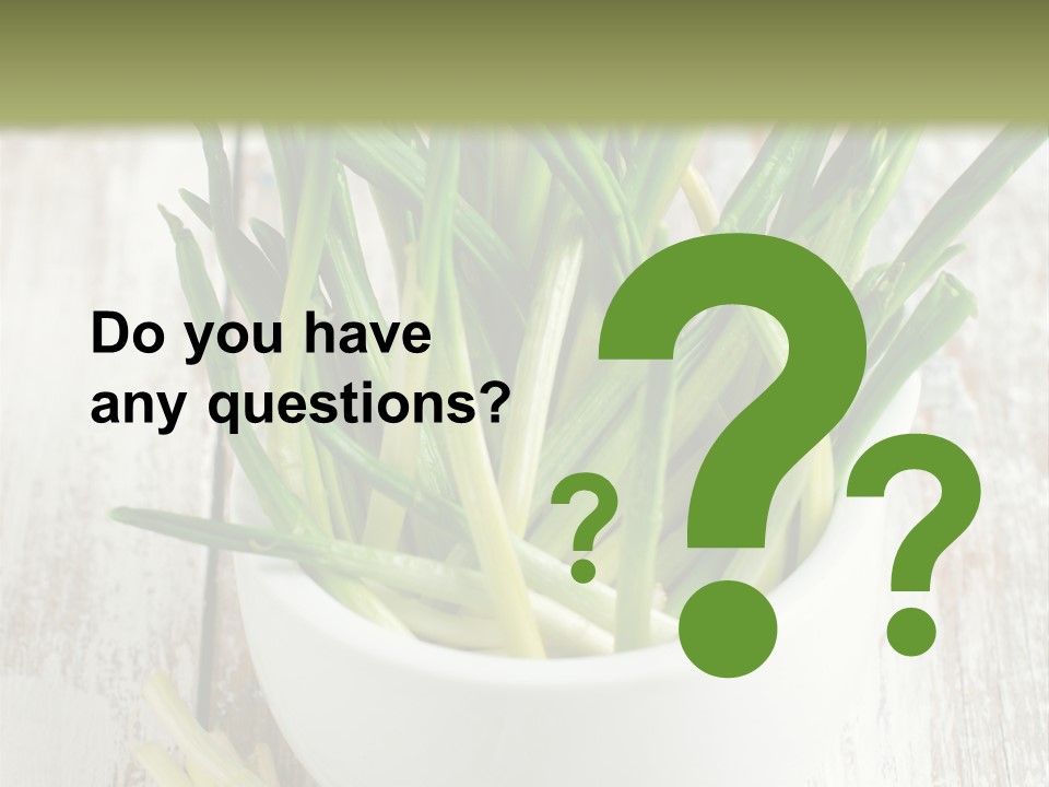 A White Bowl Filled With Green Plants On Top Of A Wooden Table PowerPoint Template