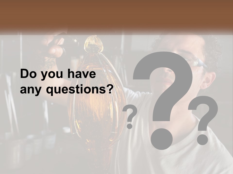 A Man Holding A Bottle Of Oil In His Hand PowerPoint Template