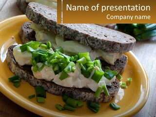 A Yellow Plate Topped With A Sandwich Covered In Cheese And Green Onions PowerPoint Template