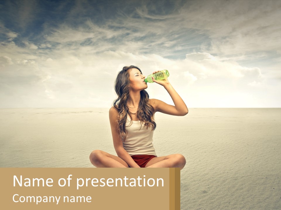A Woman Sitting On A Beach Drinking A Bottle Of Water PowerPoint Template
