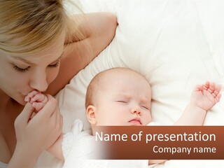 A Woman And A Baby Laying On A Bed PowerPoint Template