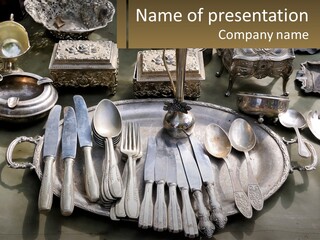 A Table Topped With Lots Of Silverware And Silverware PowerPoint Template