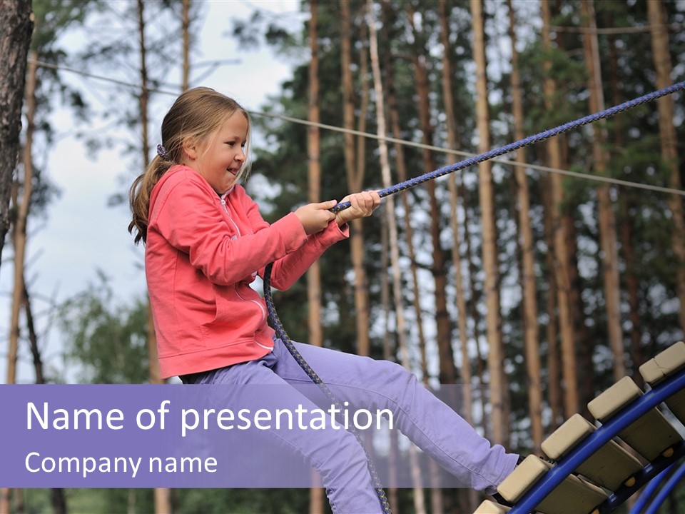 A Little Girl On A Rope In A Park PowerPoint Template