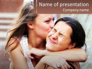 A Couple Of Women Hugging Each Other In Front Of A Brick Wall PowerPoint Template