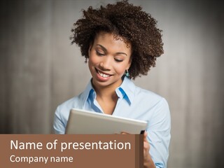 A Woman Holding A Tablet Computer In Her Hands PowerPoint Template
