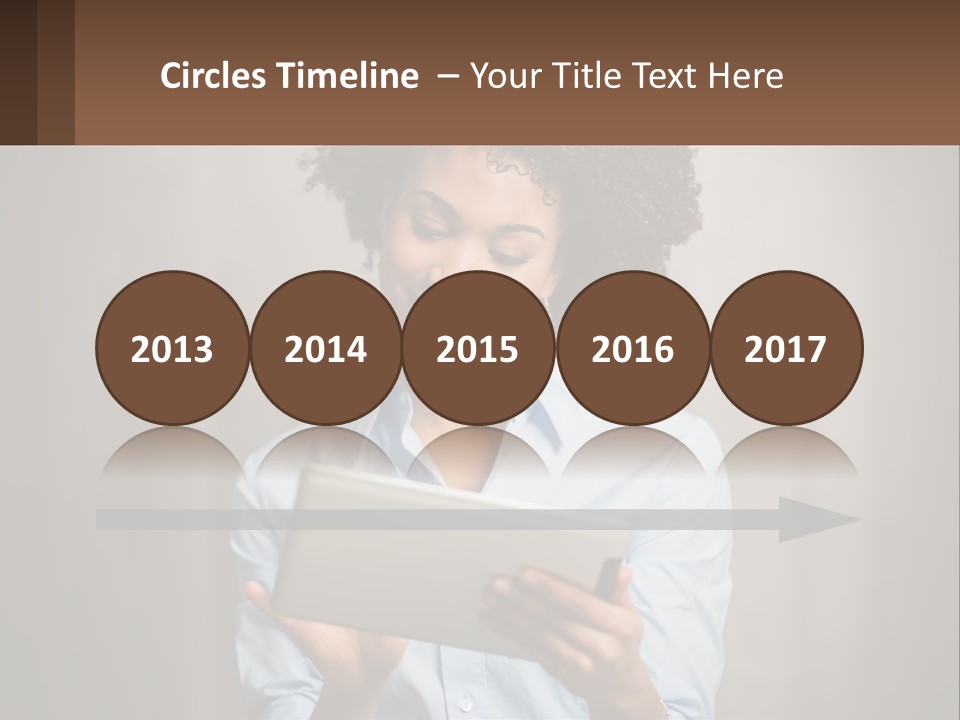 A Woman Holding A Tablet Computer In Her Hands PowerPoint Template