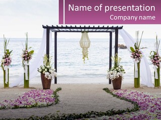 A Wedding Ceremony On The Beach With Flowers PowerPoint Template