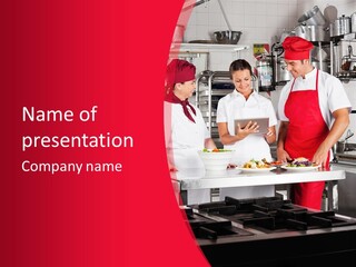 A Group Of People In A Kitchen Preparing Food PowerPoint Template