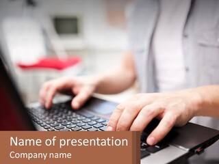 A Person Typing On A Laptop Computer PowerPoint Template