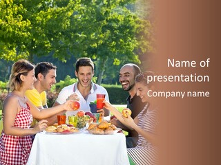 A Group Of People Sitting Around A Table With Food PowerPoint Template