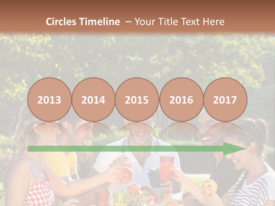 A Group Of People Sitting Around A Table With Food PowerPoint Template