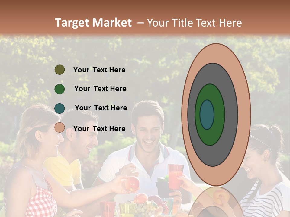 A Group Of People Sitting Around A Table With Food PowerPoint Template