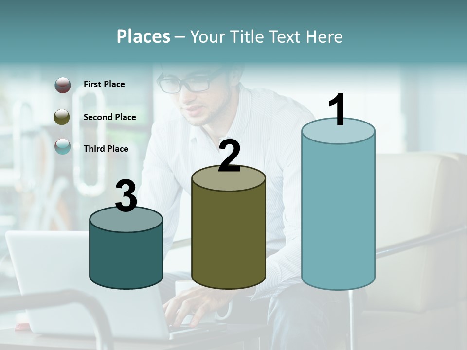 A Man Sitting At A Table Using A Laptop Computer PowerPoint Template