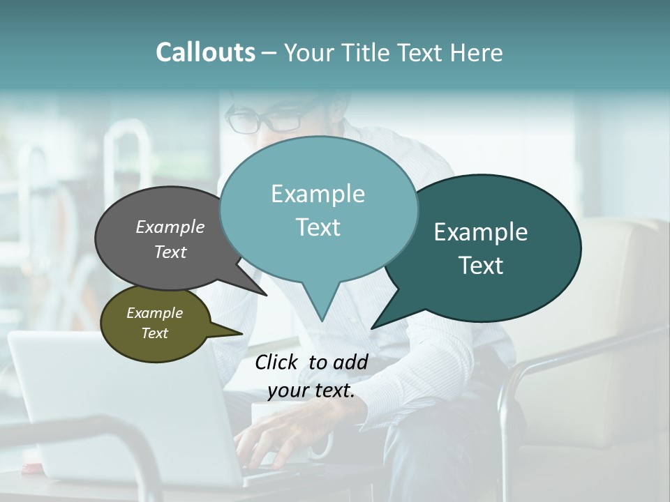 A Man Sitting At A Table Using A Laptop Computer PowerPoint Template